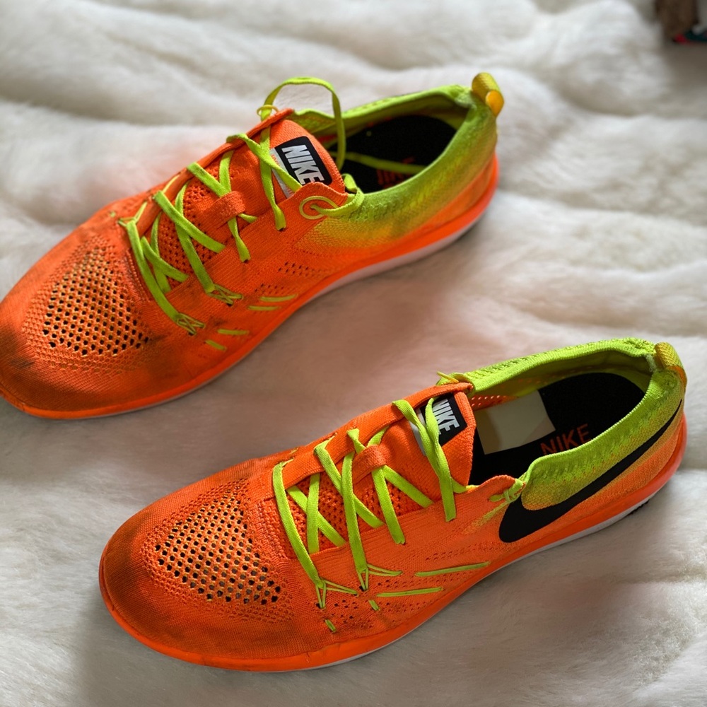 Neon orange NIKE flynit sneakers